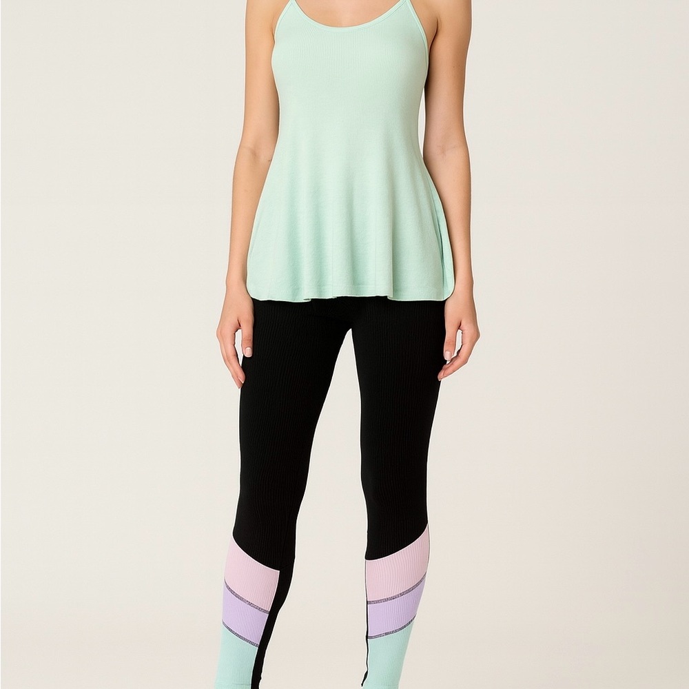Brand new with tags we The Free tank paired with Preowned Beach Riot Leggings